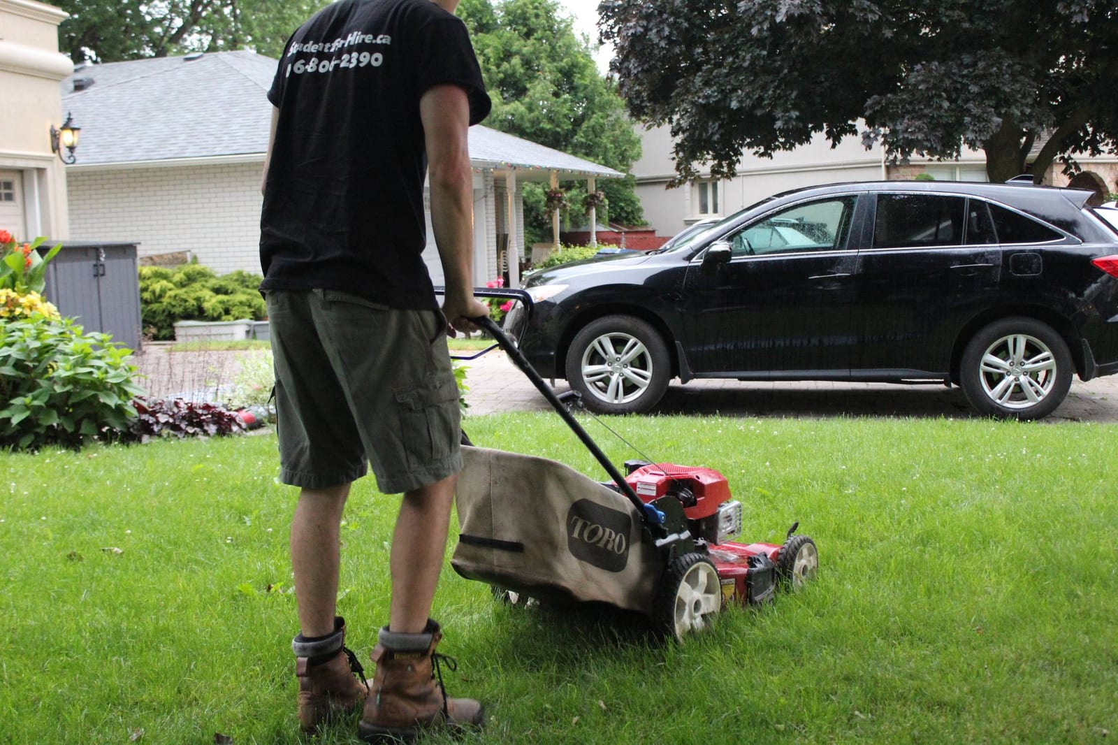A student mowing a lawn
